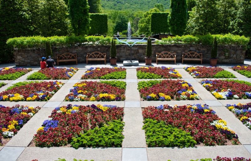 A grid of flowerbeds with fun designs resembles a quilt when viewed from above