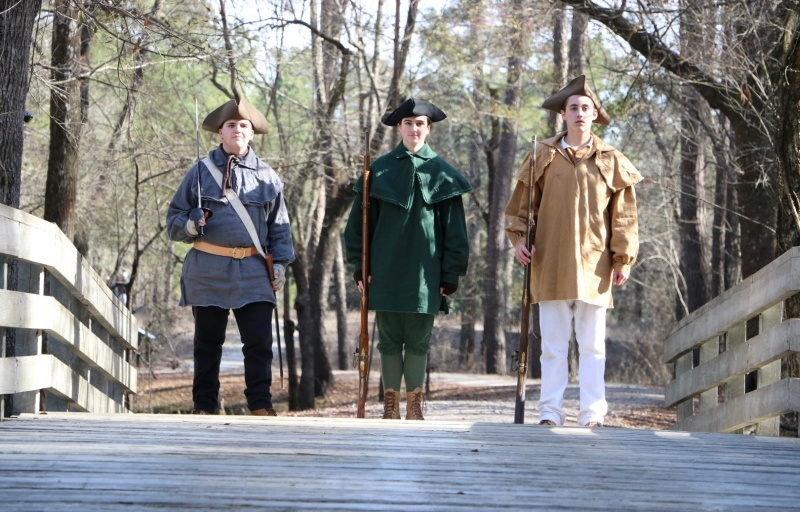 Patriots standing on Moores Creek Bridge