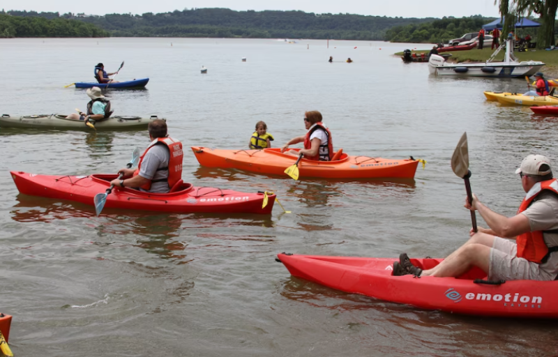 A group of kayakers out on blue marsh lake