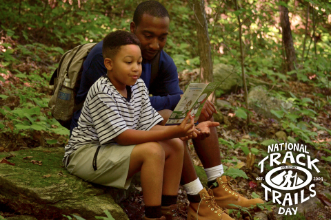 Promotional Material for NTTD - child and father looking at brochure